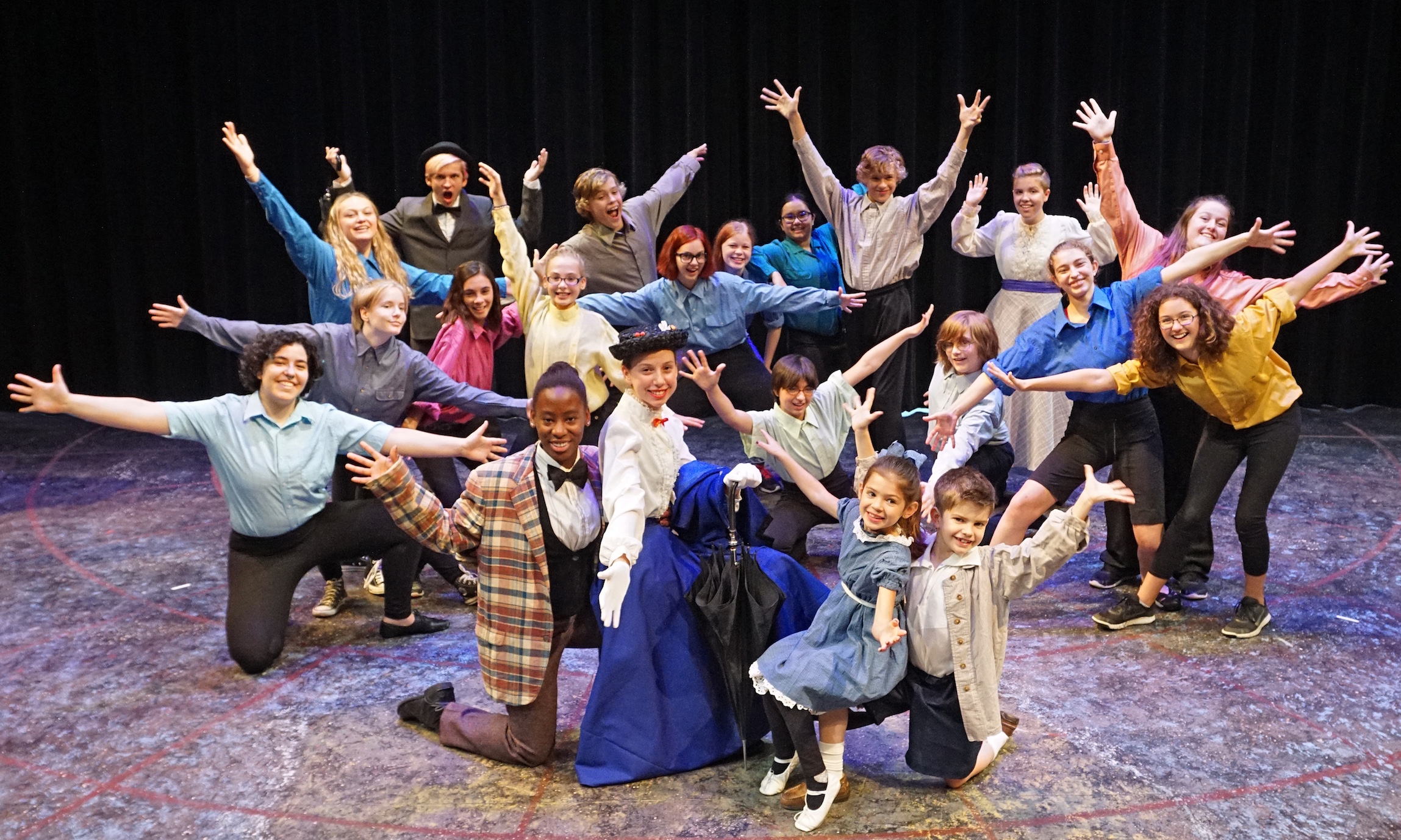 the Ensemble of Mary Poppins indulges in a little Razzle Dazzle "jazz hands" moment!